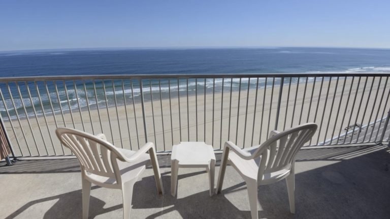 balcony view with tables and chairs