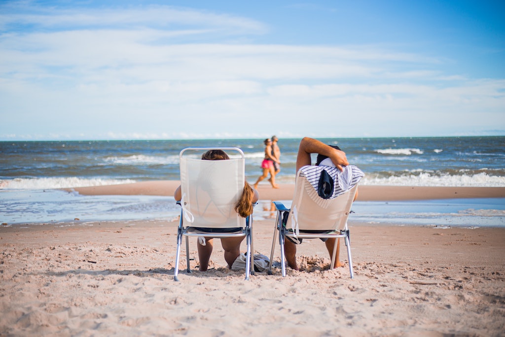 Couple sitting on beach