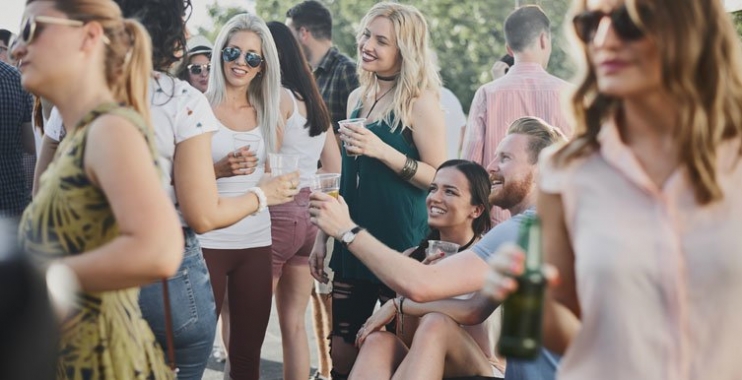 People with drinks laughing