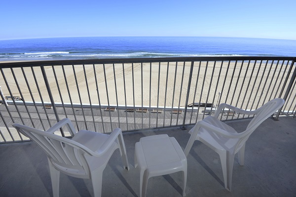 Two chairs on an oceanfront balcony at the Grand Hotel in Ocean City, MD.
