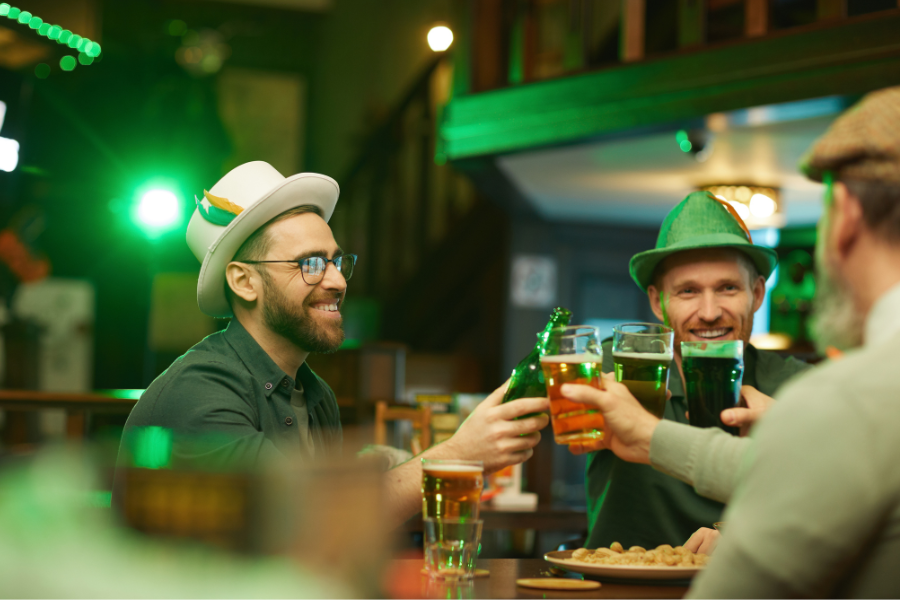 Three men drinking beer to celebrate St. Patrick's Day