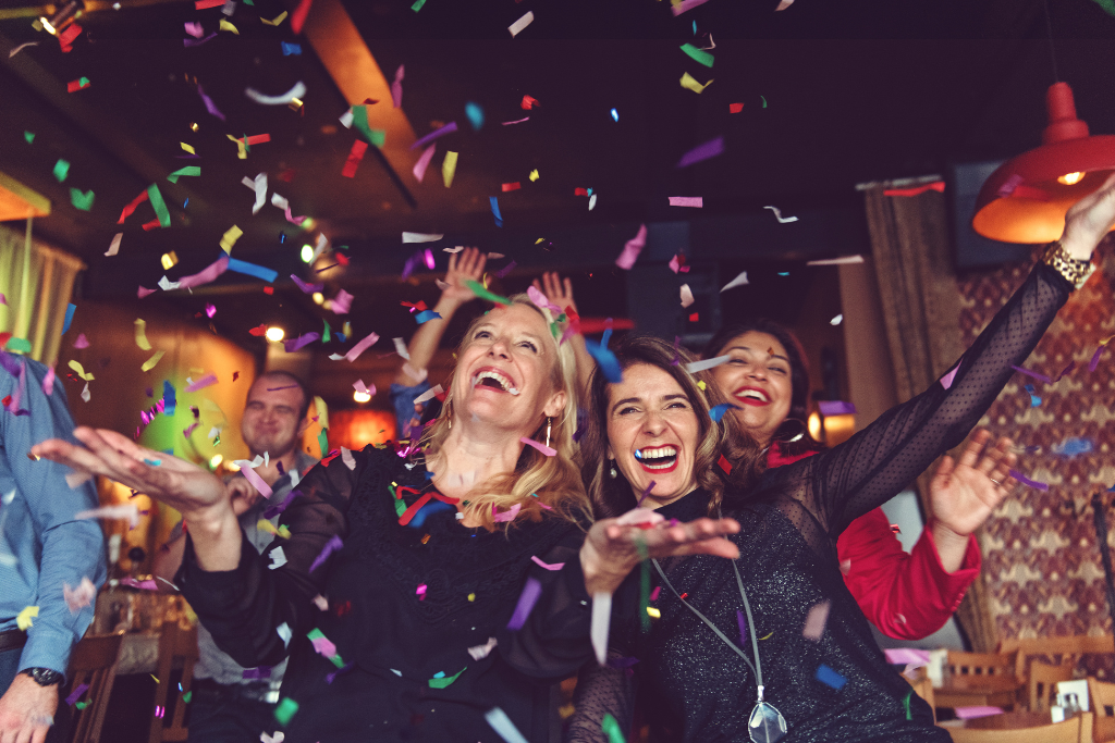 Women celebrating NYE with confetti